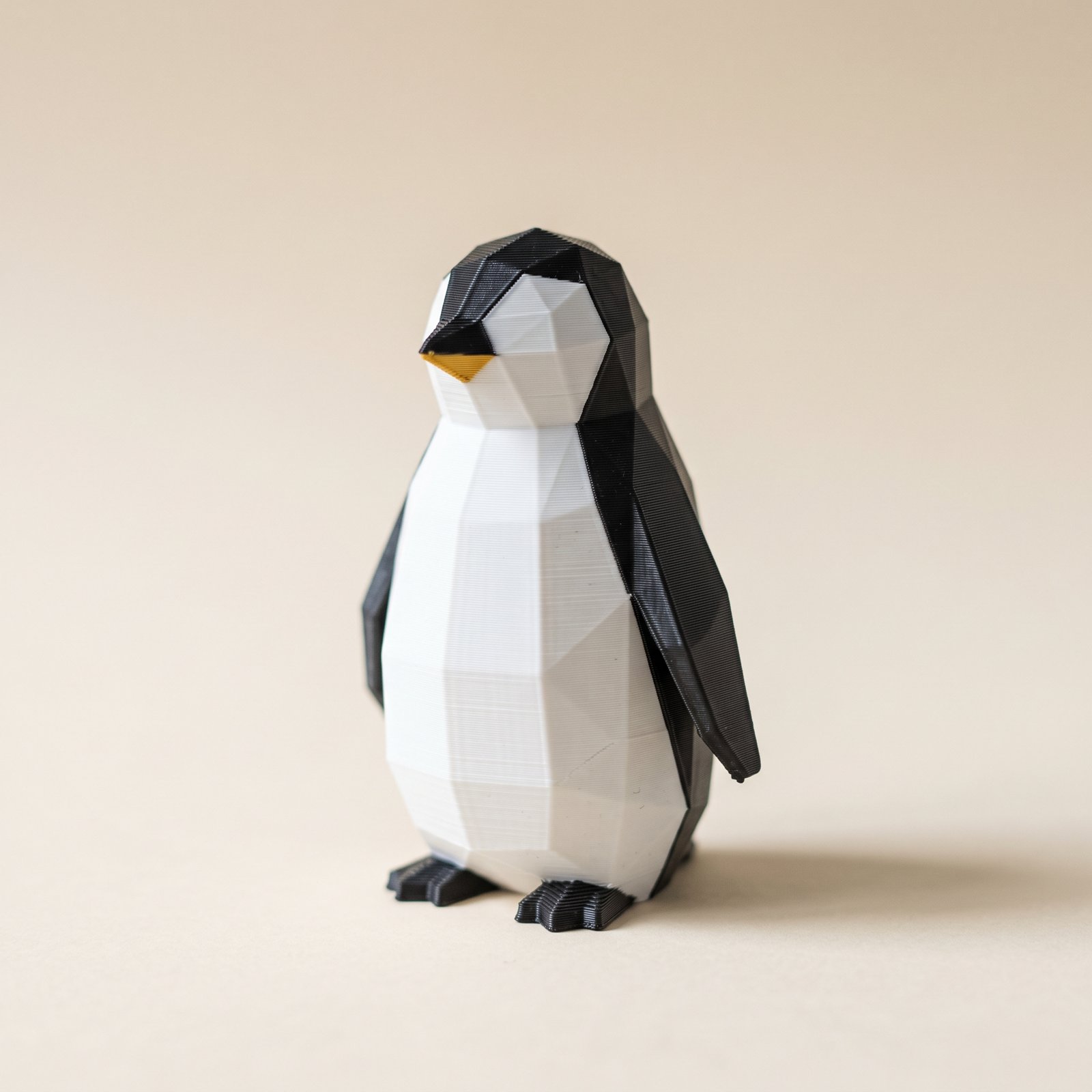 Two-tone white and black 3D printed penguin with clean color separation and no gray tint