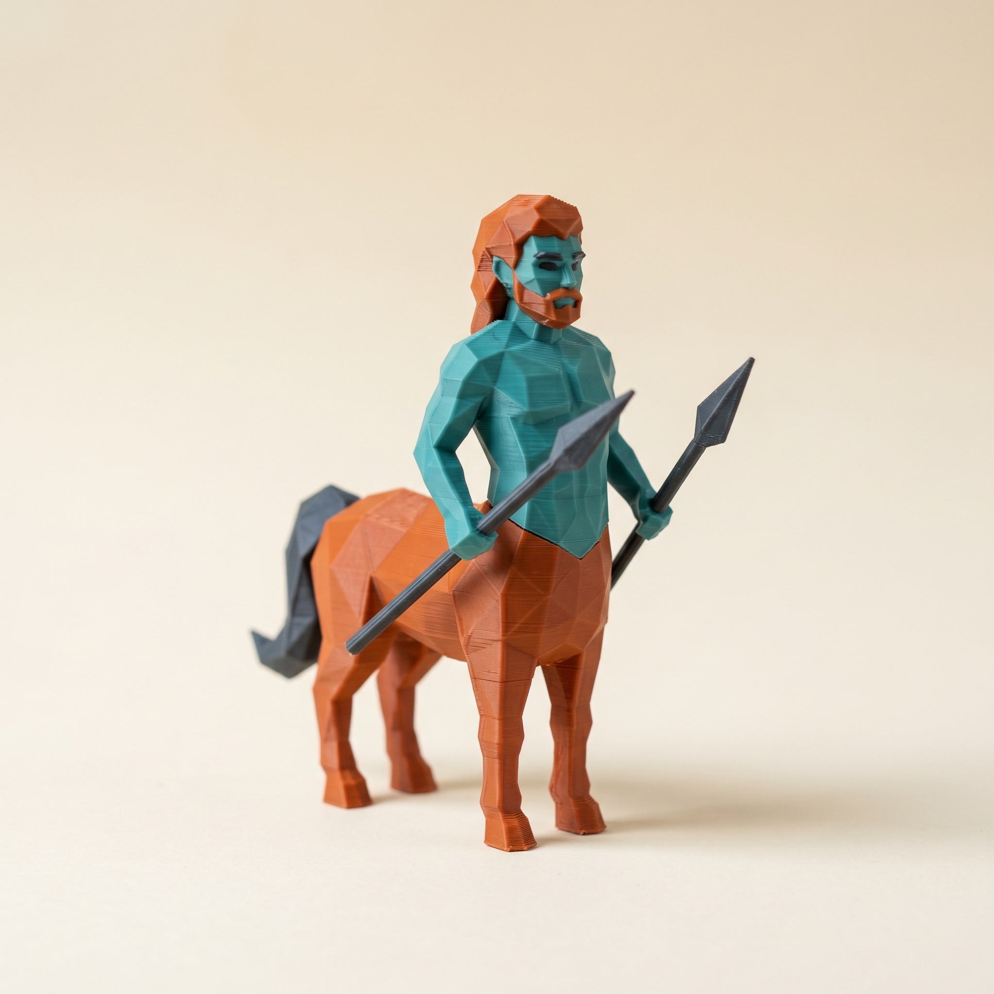 A multi-color 3D-printed low-poly centaur figurine in teal, burnt orange, and charcoal filament on a cream background