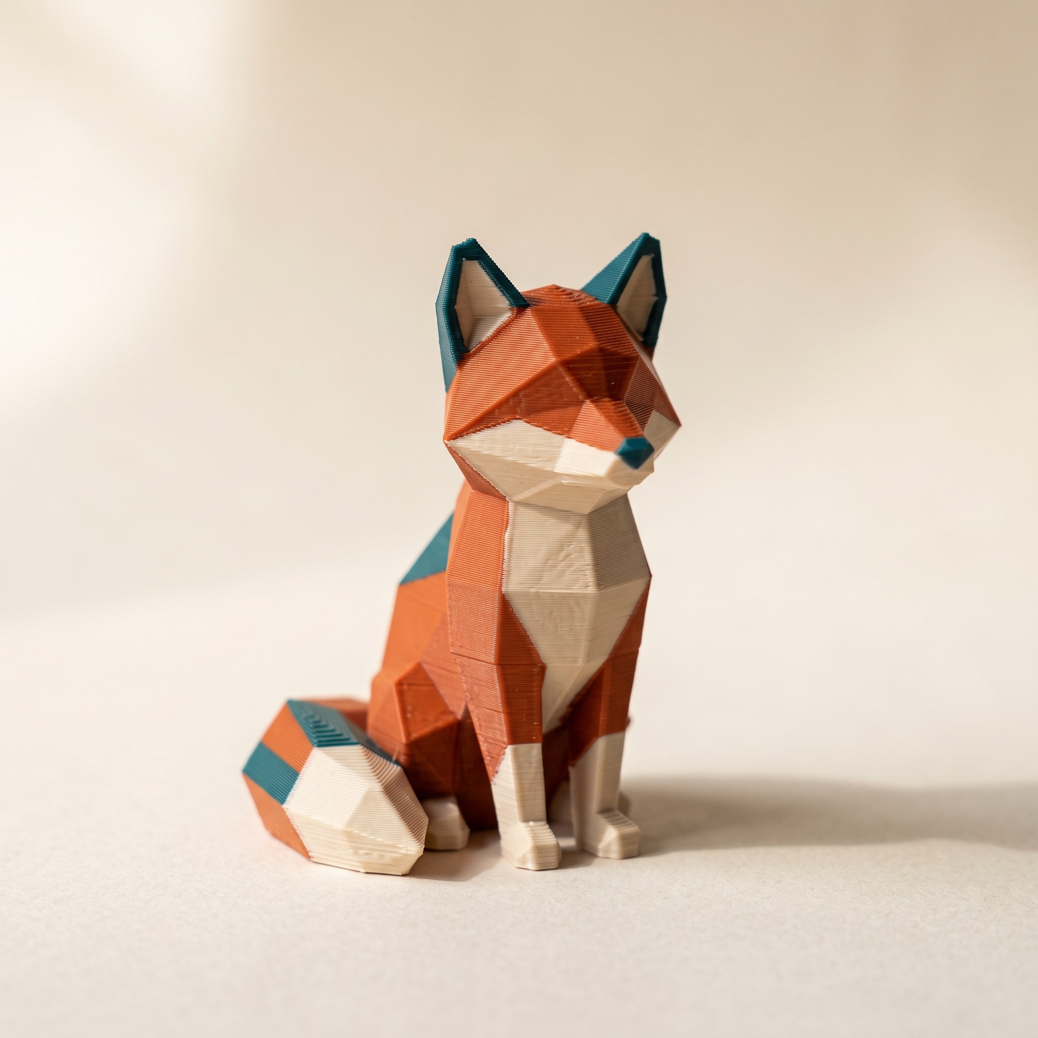 Multicolor 3D printed fox figurine, the kind of MakerWorld multicolor model a Snapmaker U1 prints cleanly after a proper import